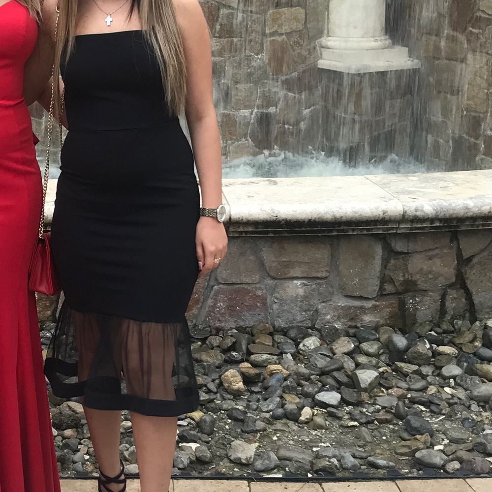 Black bodycon cocktail dress.